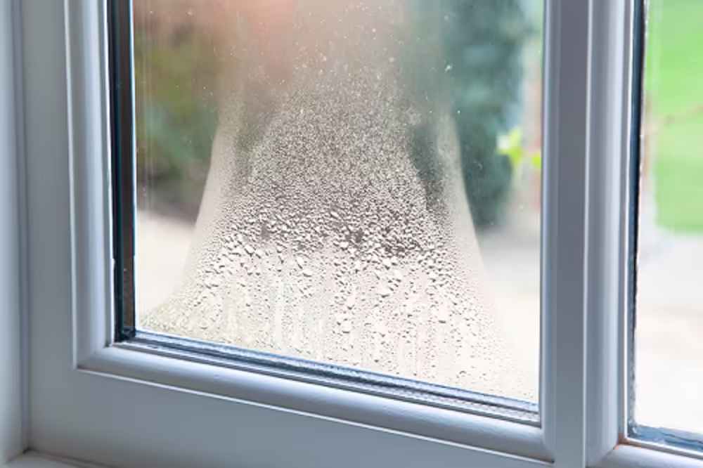 An older window with condensation that needs to be cleaned