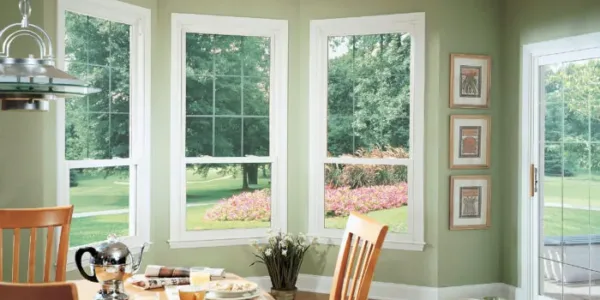 Sliding patio doors and 3 double-hung window in kitchen