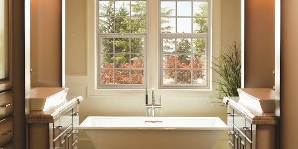 Alside windows behind a free standing tub in a bathroom