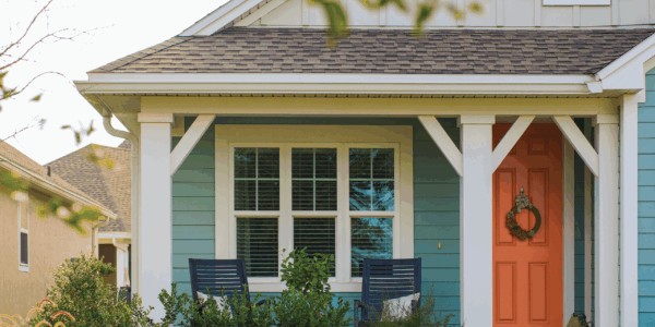 Home with blue vinyl and 3 windows