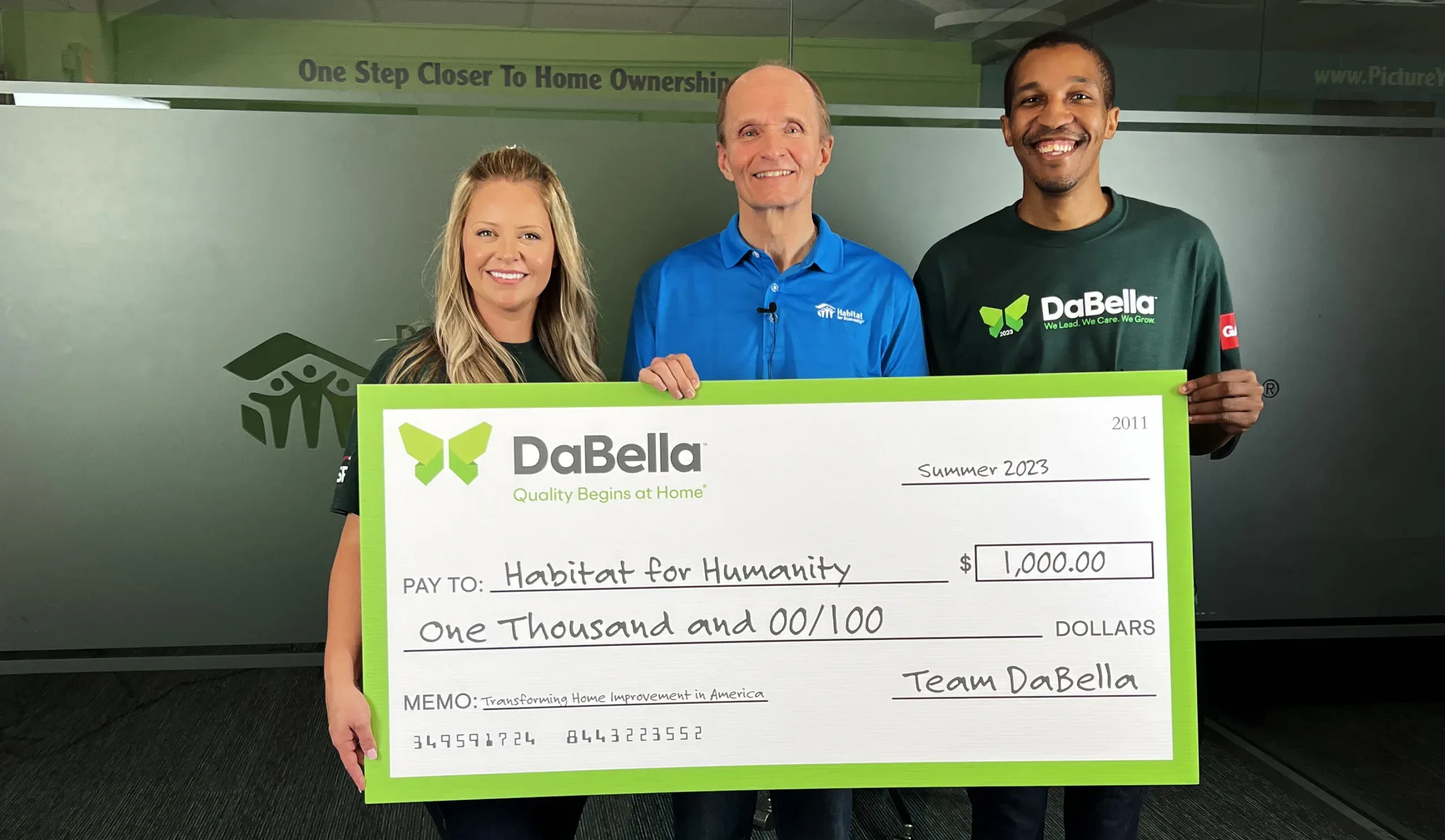 DaBella Dallas donating a $1000 check to Habitat for Humanity