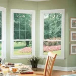 Sliding patio doors and 3 double-hung window in kitchen