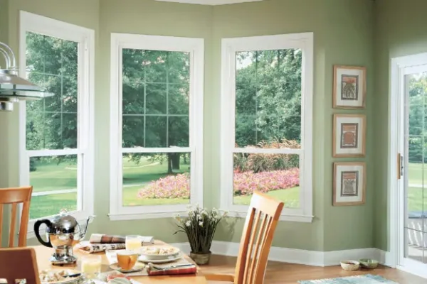 Sliding patio doors and 3 double-hung window in kitchen