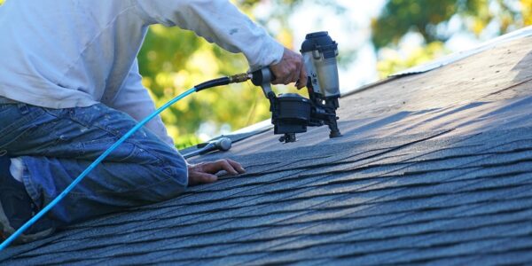 Roof Installer using a Nail Gun