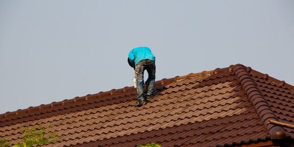 Roofer Painting a Tile Roof