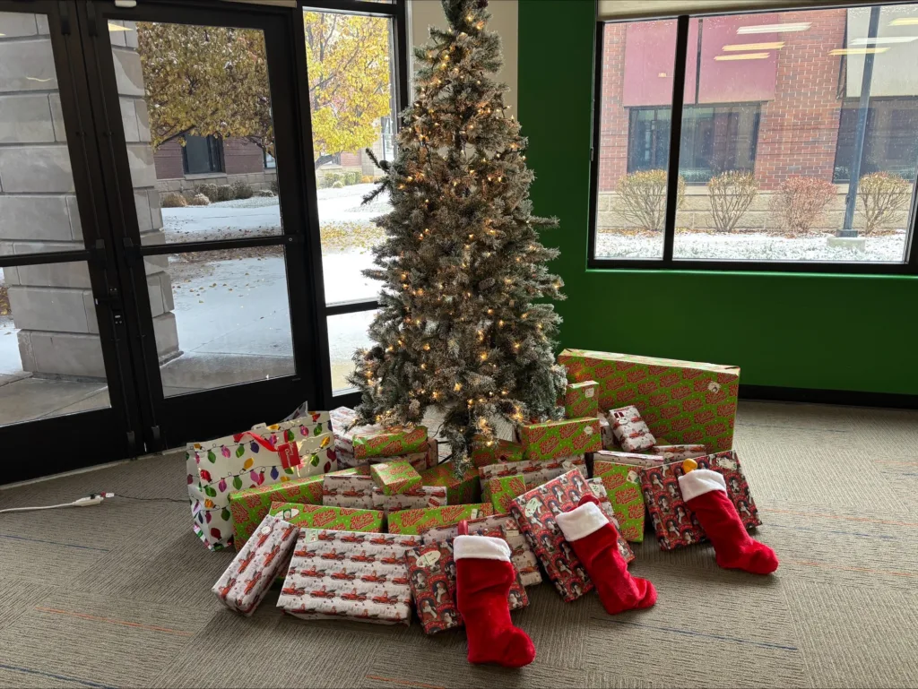 DaBella's office in Idaho Falls, ID with a tree with presents for the Wessels family.