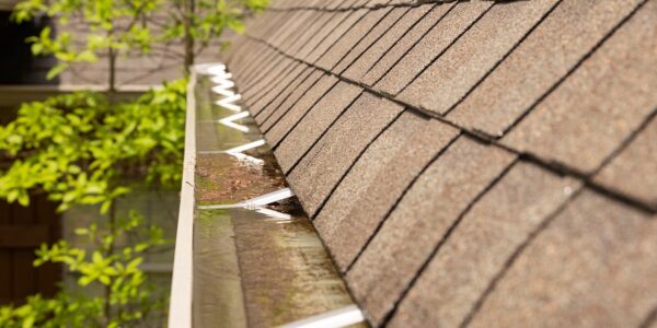 Clogged gutters caused by a clogged downspout