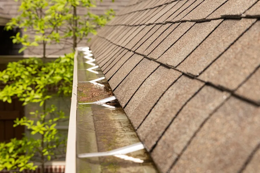 Clogged gutters caused by a clogged downspout