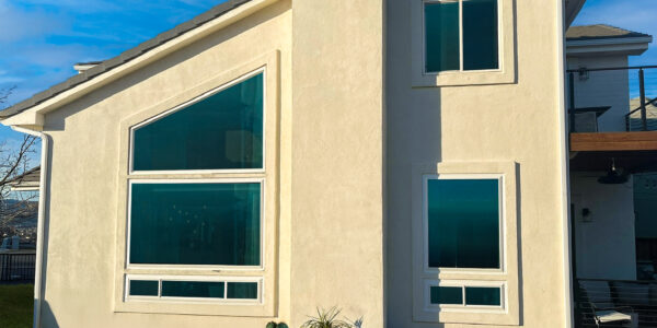 Glasswing Vinyl Replacement Windows on a home with stucoo siding