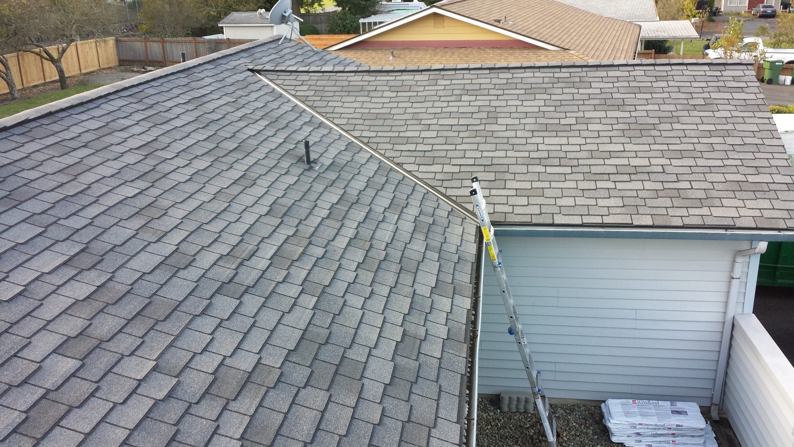 Asphalt roof showing signs of defective shingles and granular loss.